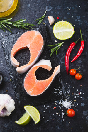 Raw trout steaks with seasoningsの写真素材