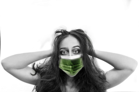 Girl mask to protect her corona virus pandemic woman European isolated background medicalの写真素材