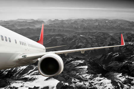 Plane in the sky flight travel transport airplaneの写真素材