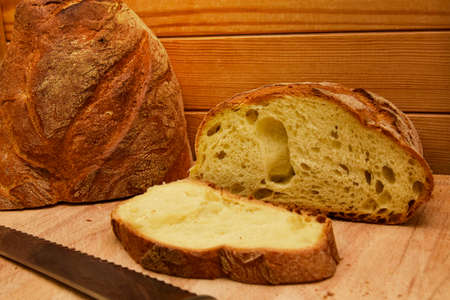 Bread knife on a Wooden Table isolatedの写真素材