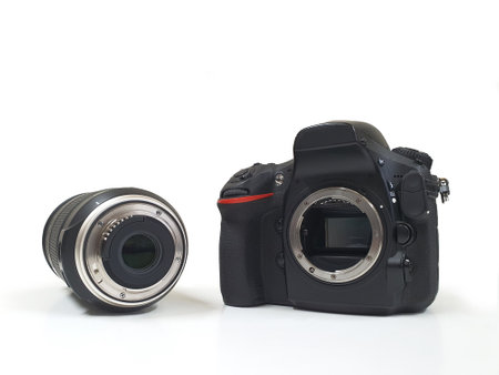 Digital camera with tele lens, professional isolated on whiteの写真素材