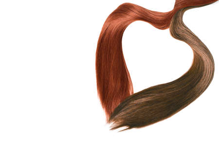 Brown red Natural hair on heart shape, isolated on white backgroundの写真素材