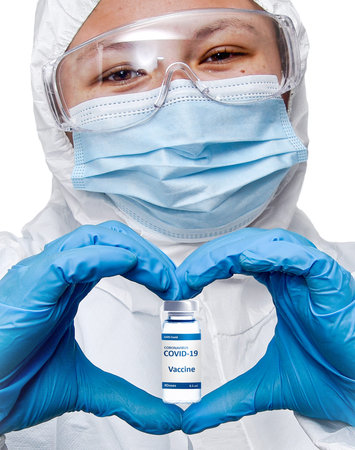 COVID-19 Vaccine Medical healthcare NHS technician holding make the heart