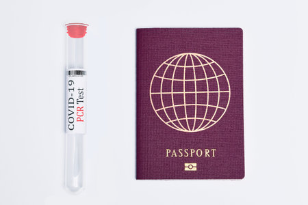 COVID-19 and travel concept, mark of coronavirus PCR testing in tourist Italian passport. Business...
