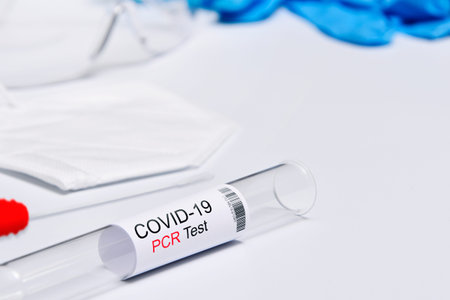 Kit tested Covid-19, Coronavirus symptoms medical concept with PPE and Swab PCR test on white...
