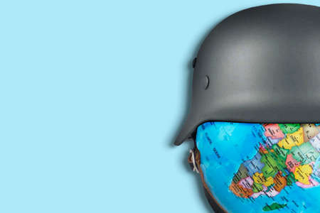 Earth with war helmet, war background concept to Russia and Ukraineの写真素材