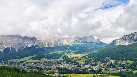 Clouds in the mountains landscape, beautiful nature background, green treesの写真素材