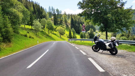 Motorcycle Road through the mountains, beautiful nature background, green trees Motorcycleの写真素材