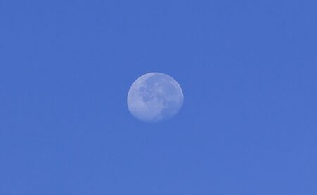 Daylight moon in the blue sky at Bogor, West java, Indonesia so beautiful.の写真素材