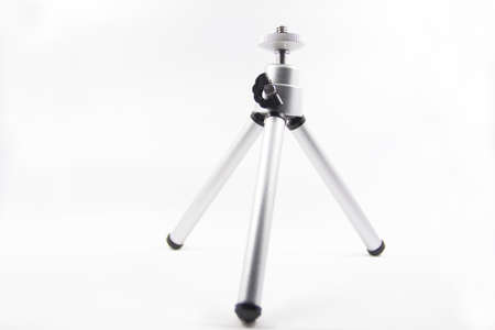 A mini tripod isolated with white background.の写真素材