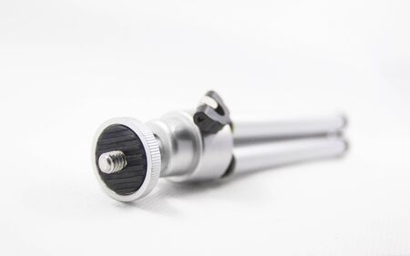 A mini tripod isolated with white background.の写真素材