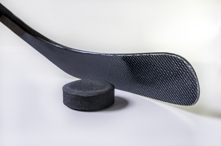 hockey stick and puck on the white backgroundの写真素材