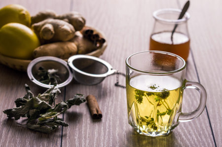 Still life with tea. Natural herbal tea with mentha, honey and lemon.