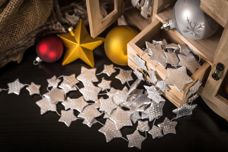 old wooden box with various Christmas decorationsの写真素材