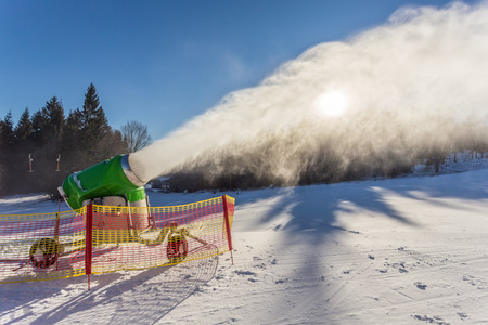 working snow gun on a hillside in the resortの写真素材
