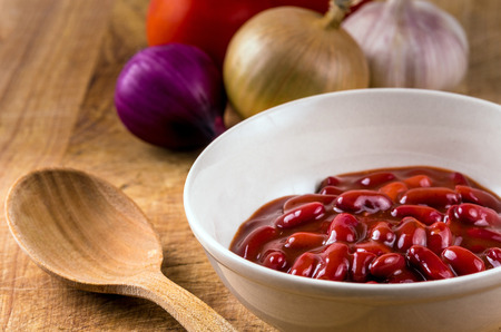 A bowl of boiled red kidney beans. Onion, garlic, tomato.の写真素材