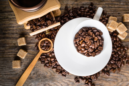 coffee beans with grinder, coffee cup and cane sugarの写真素材