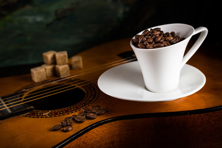 coffee beans with  coffee cup and cane sugar on a guitarの写真素材
