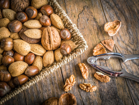 steel nutcracker and nuts of various kinds
