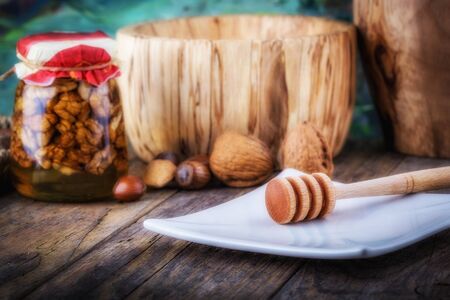 nuts in honey and nuts of various kinds, honey dipperの写真素材