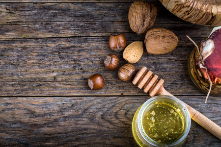honey dipper and nuts in honey, nuts of various kinds,の写真素材