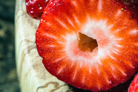 wooden bowl of fresh strawberries on old wooden tableの写真素材