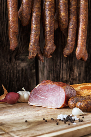 collage of different kinds of meat and smoked sausage meatの写真素材