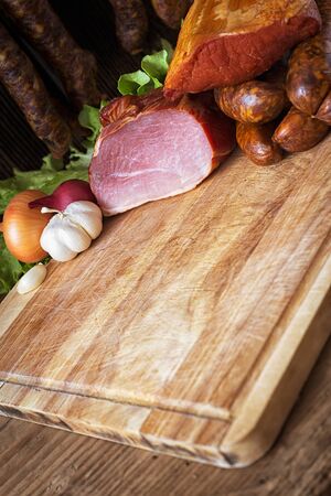 collage of different kinds of meat and smoked sausage meatの写真素材