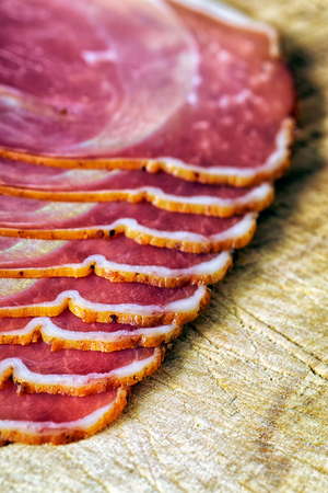sliced and smoked ham with schwarzwald ham or prosciuttoの写真素材
