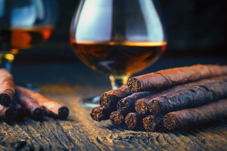 quality cigars and cognac on an old wooden tableの写真素材