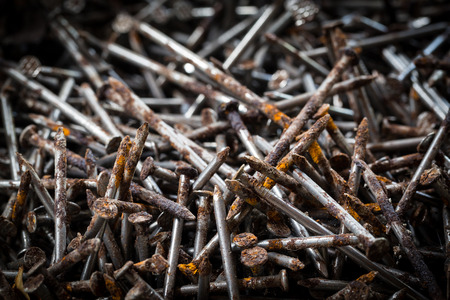 Stack of old rusty nails, detail of old workshop.の写真素材