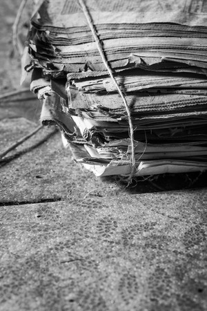a pile of old newspapers tied with twineの写真素材