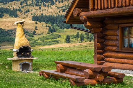 cottage in the middle of mountain meadows in the middle of Europeの写真素材