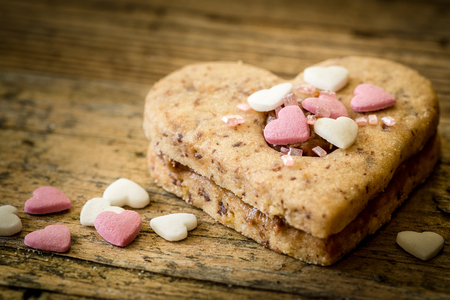 cake in the shape of a heart with decoration in the form of small heartsの写真素材