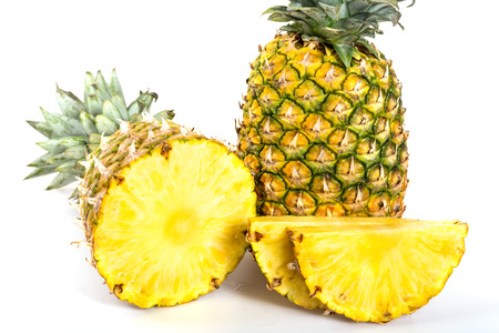 Sliced healthy fresh pineapple on white backgroundの写真素材