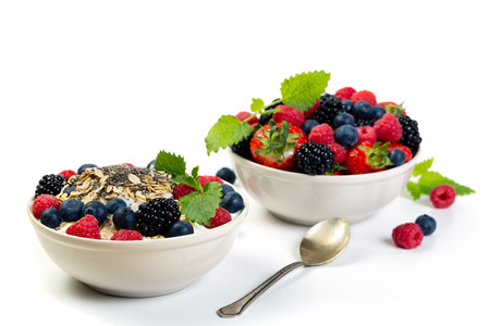 Bowl of berries. Blackberries; raspberries; blueberries, strawbwrries on a white background. Healthy breakfastの写真素材