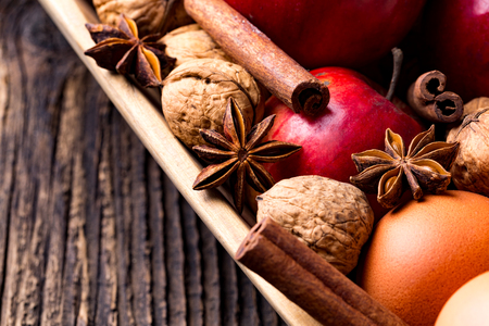 Wooden bowl with apple, eggs, walnut, cinnamon and star anise. Cooking apple pie.の写真素材