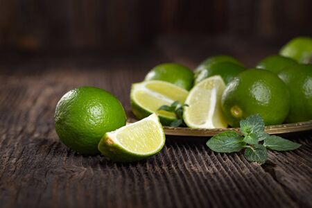 Bunch of fresh green limes, ready to be juiced.の写真素材
