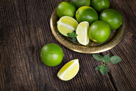 Bunch of fresh green limes, ready to be juiced.の写真素材