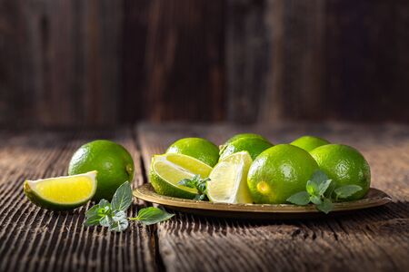 Bunch of fresh green limes, ready to be juiced.の写真素材
