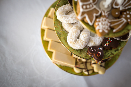 Fresh christmas cookies from the oven on the plate.の写真素材