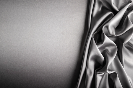 Shiny silver satin curved in various lines.の写真素材
