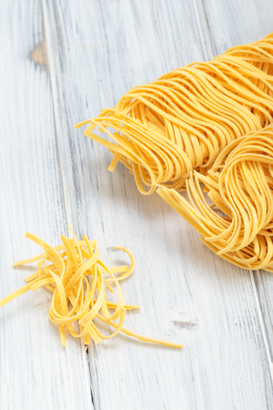 Fresh homemade Italian pasta on a tableの写真素材