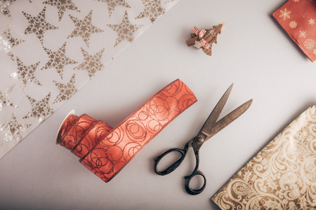 Decorative ribbon and old tailor's scissors. Christmas craft supplies.の写真素材