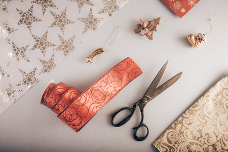 Decorative ribbon and old tailor's scissors. Christmas craft supplies.の写真素材