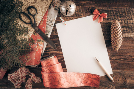 Christmas wish list for Santa. Top-down view on a blank letter on the wooden table.の写真素材
