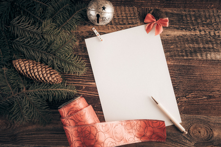 Christmas wish list for Santa. Top-down view on a blank letter on the wooden table.の写真素材
