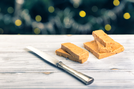 TurrÃ³n is a traditional Spanish sweets. Decorations of almonds and beautiful bokeh.の写真素材