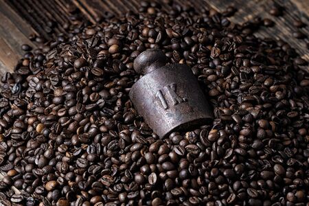 One kilogram weight in bunch of roasted coffee beansの写真素材