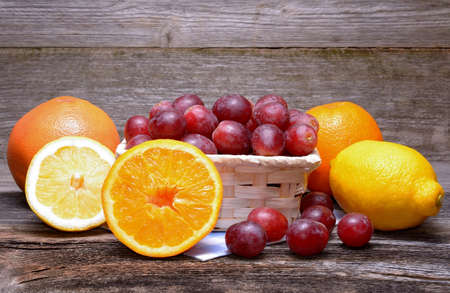 Assortment of fruits on a wooden backgroundの写真素材
